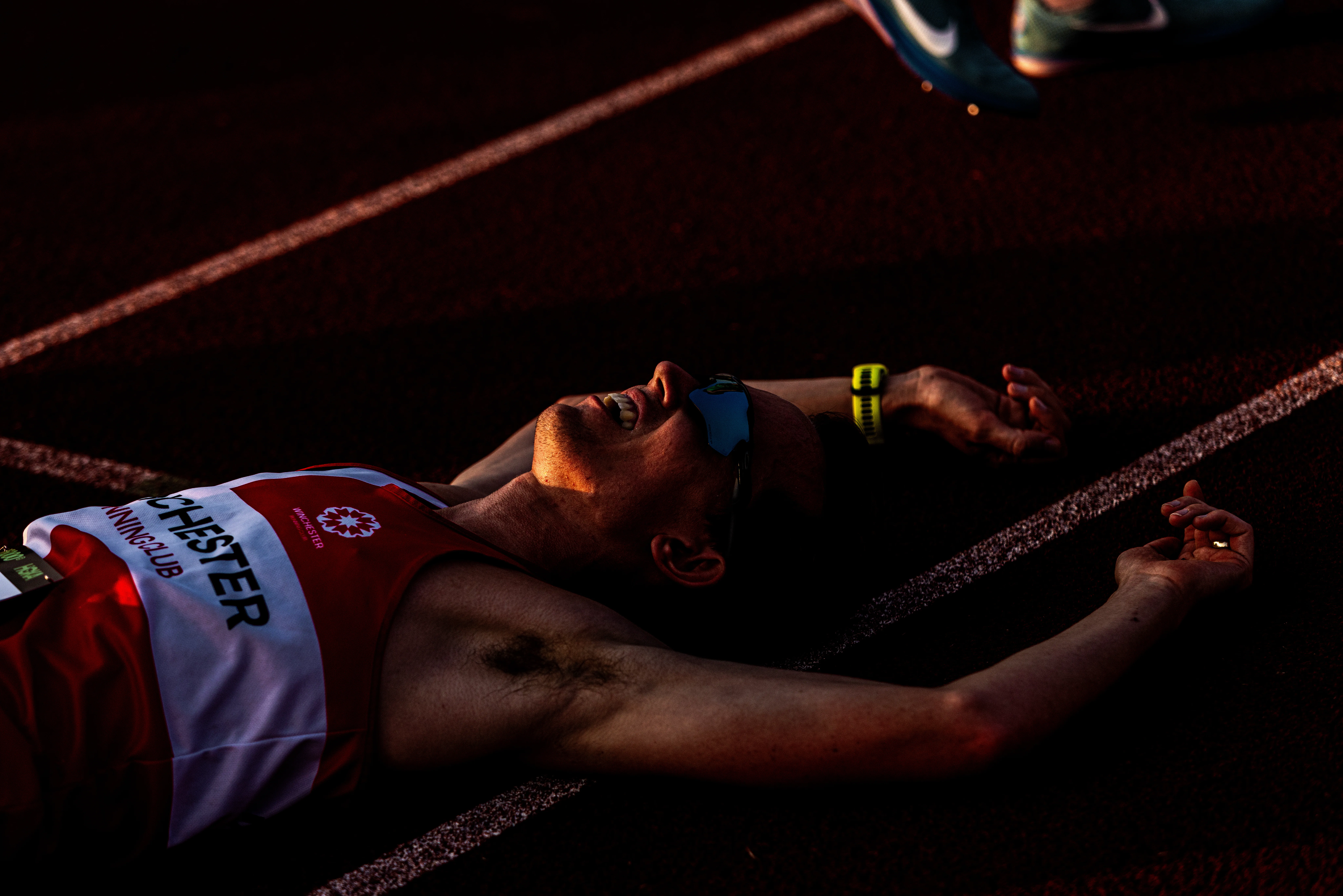 image of runner recovering on ground